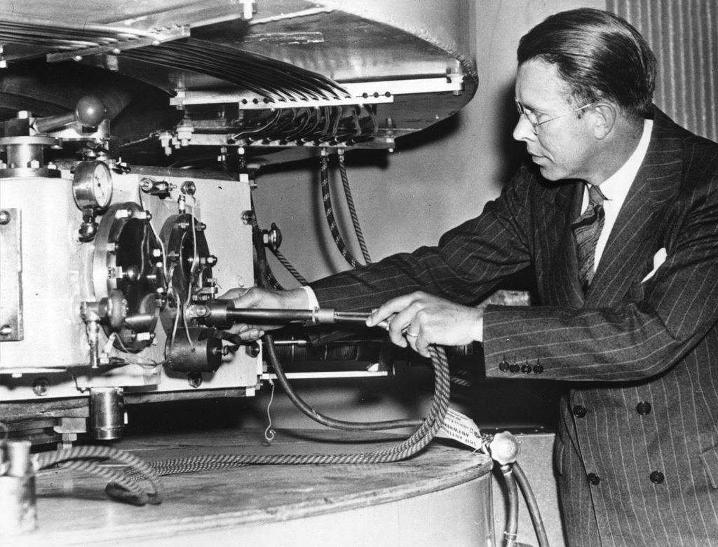 Ernest Lawrence tinkering with his cyclotron